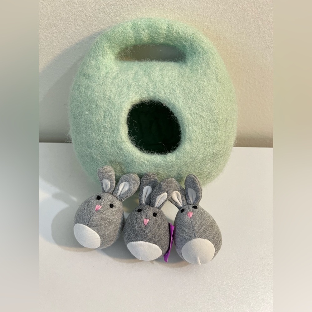 Lovevery bunnies in a felt burrow